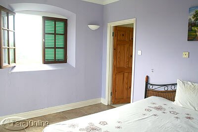 One of the three guest bedrooms